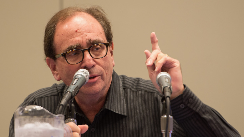 R.L. Stine at a mic, pointing