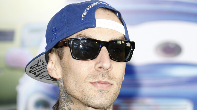 Travis Barker sunglasses baseball cap