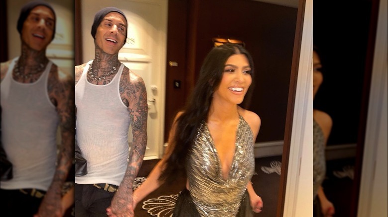 Travis Barker and Kourtney Kardashian laughing