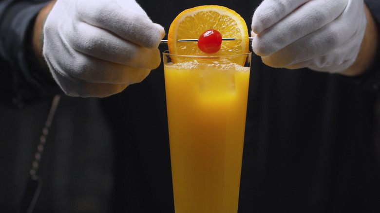 Bartender preparing Tequila Sunrise