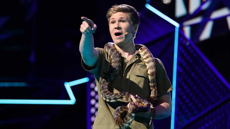 Robert Irwin holding snake