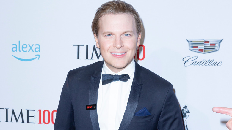 Ronan Farrow awkwardly smiling