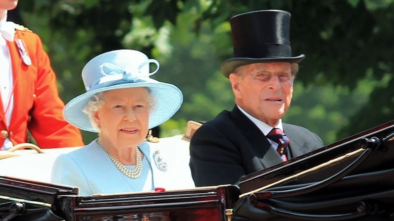 Queen Elizabeth and the Prince Philip in a carriage