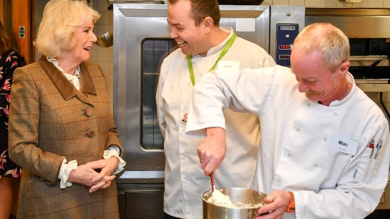 Camilla Parker Bowles with two chefs
