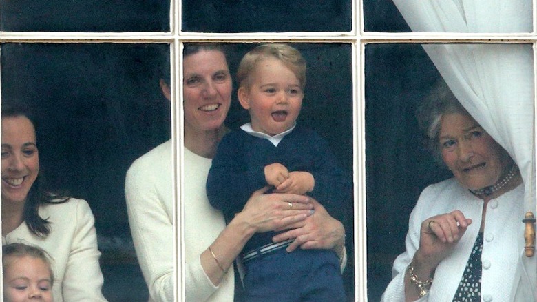 Royal nanny at a window with Prince George