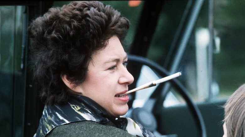 Princess Margaret smokes a cigarette