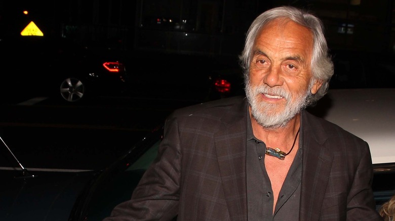 Tommy Chong exits a car