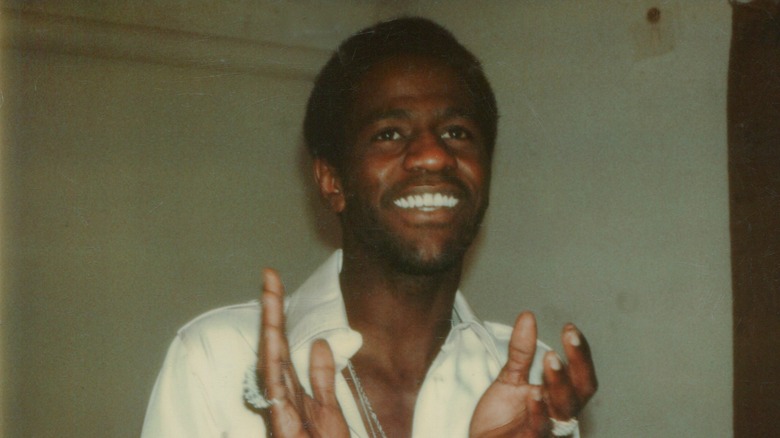 Al Green smiling and clapping