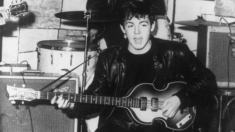 Paul McCartney playing bass in 1960