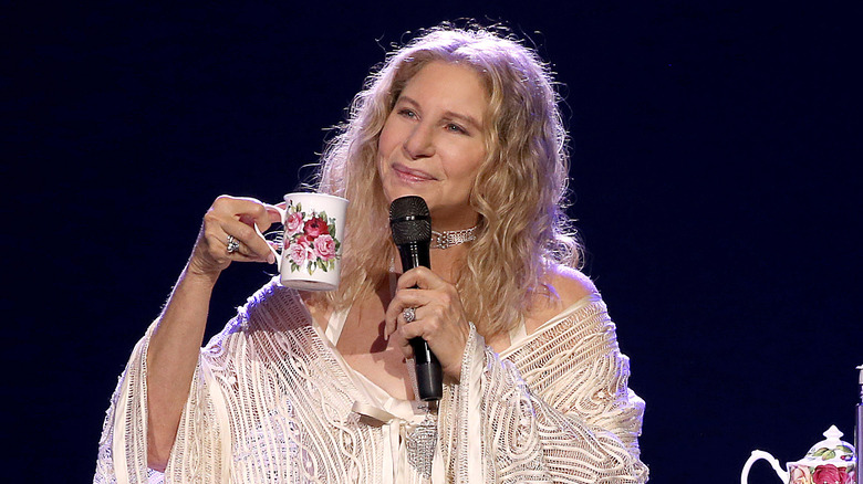 Barbra Streisand with microphone and tea cup