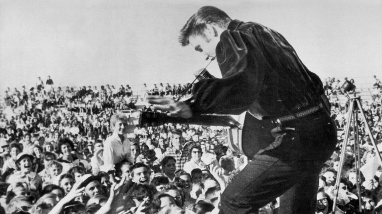 Elvis performing to a crowd of fans