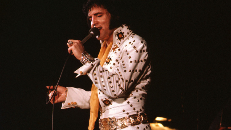 Elvis performing white suit