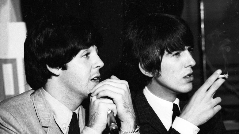 George Harrison and Paul McCartney in 1964