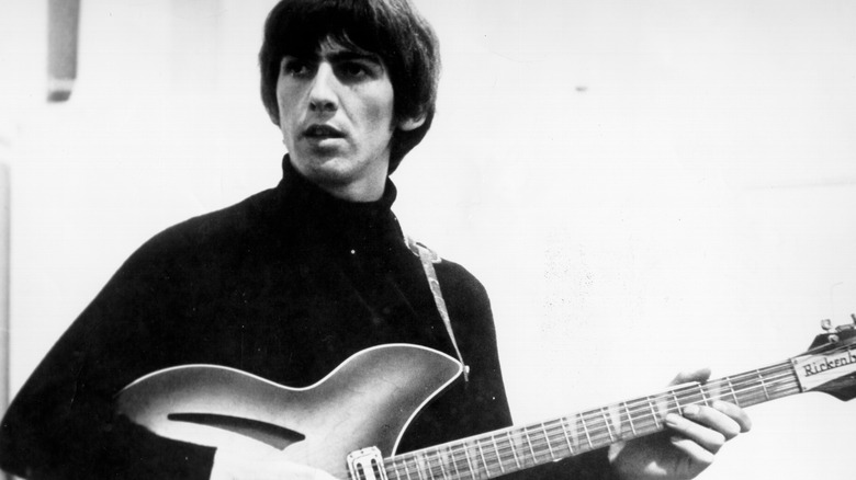George Harrison playing guitar