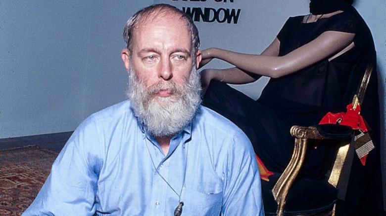 Edward Gorey in front of a mannequin