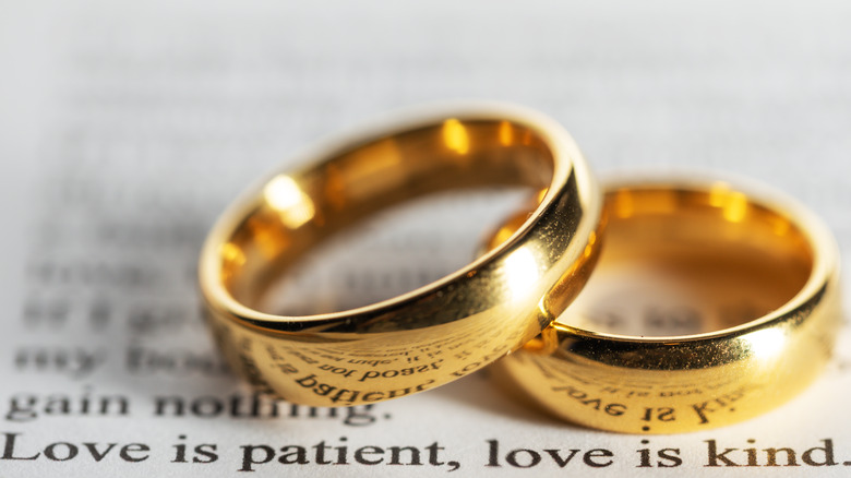 Wedding rings on text