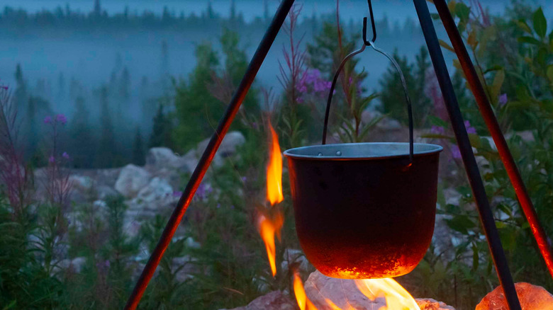 Pot hanging over open fire