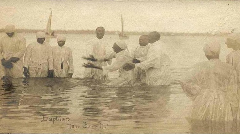 Historical postcard of a river baptism in New Bern, North Carolina