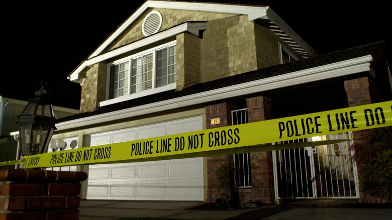 Police tape at suburban home