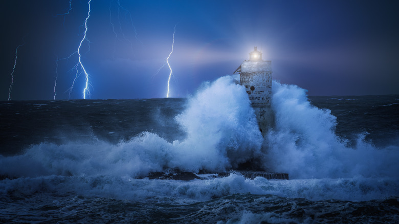 Lighthouse in a storm with lightning