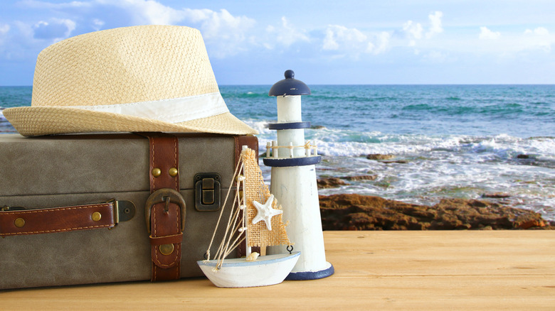 Model lighthouse and luggage