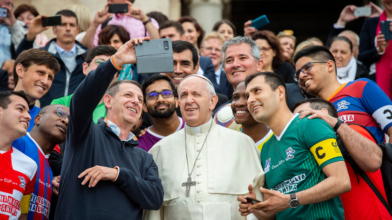 Pope Francis meets a Catholic soccer team