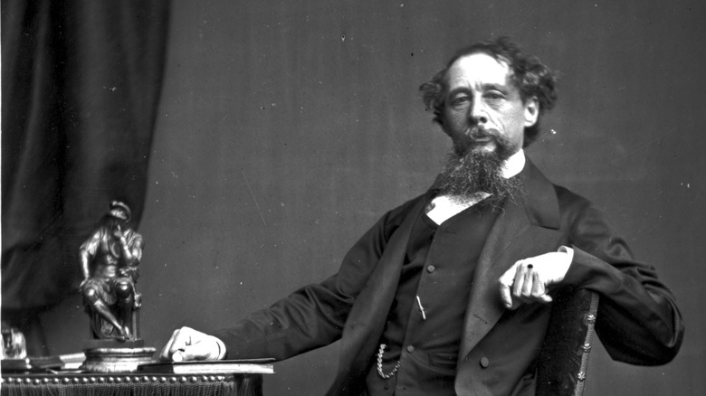 Charles Dickens at a desk