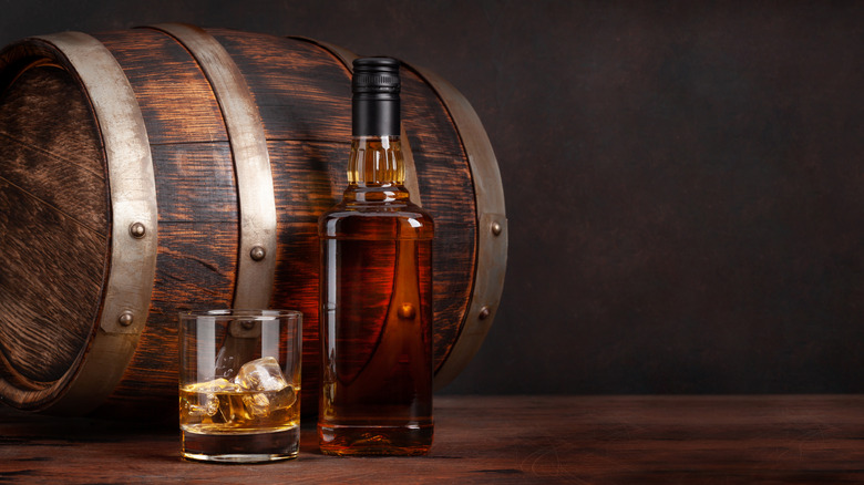 Whiskey barrel with glass