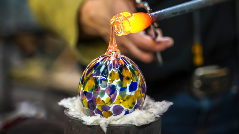glassblower making glass ball