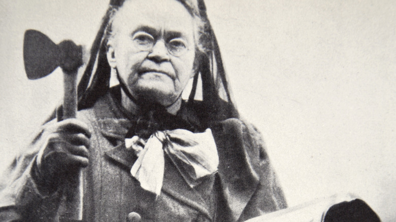 Carrie Nation with hatchet and bible
