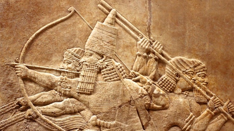 Ancient Mesopotamian soldiers carved into stone