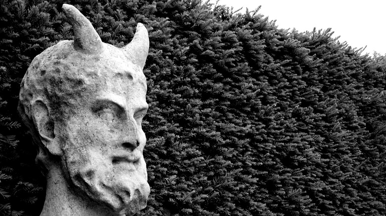 Devil Statue in Kew Gardens, Richmond upon Thames, black and white