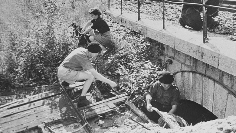members of the Maquis practicing train tunnel sabotage