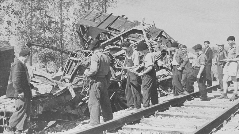 Maquis group inspecting a destroyed train