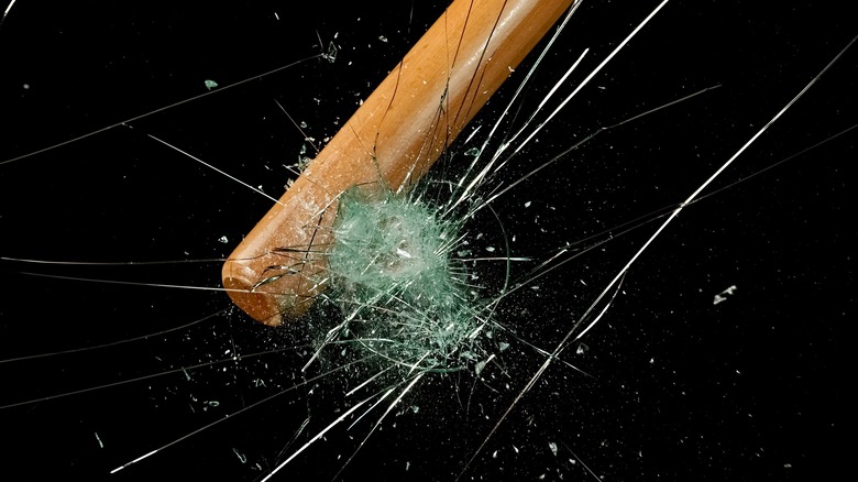 Baseball bat hitting glass