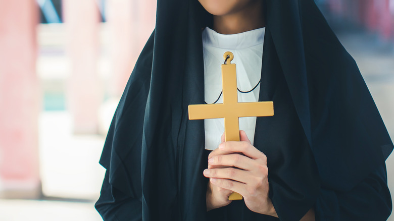 Nun holding cross
