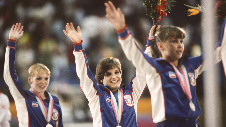 Olympic gymnasts smiling and celebrating