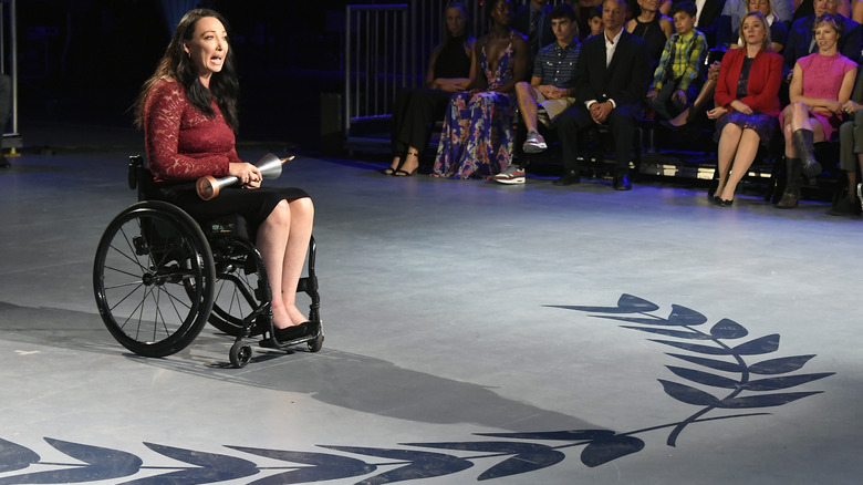 Amy Van Dyken speaking onstage