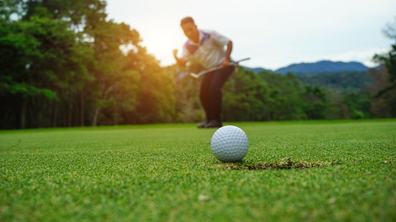 Golfer celebrating a putt