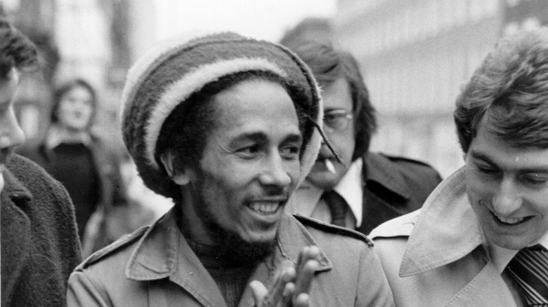 black and white photo of bob marley in a crowd