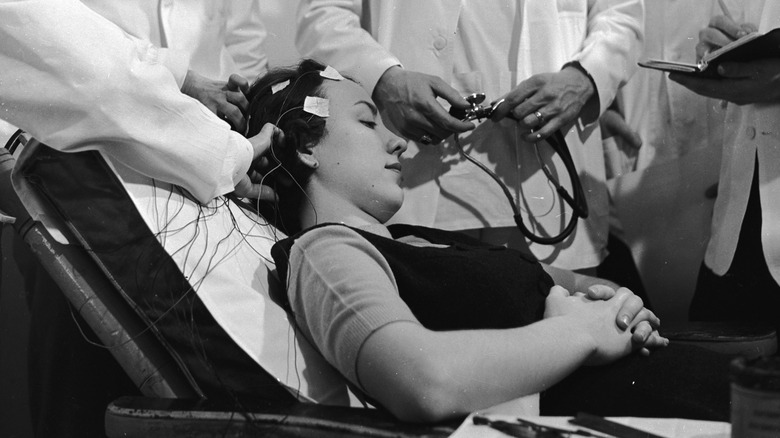 Woman being fitted with electrodes