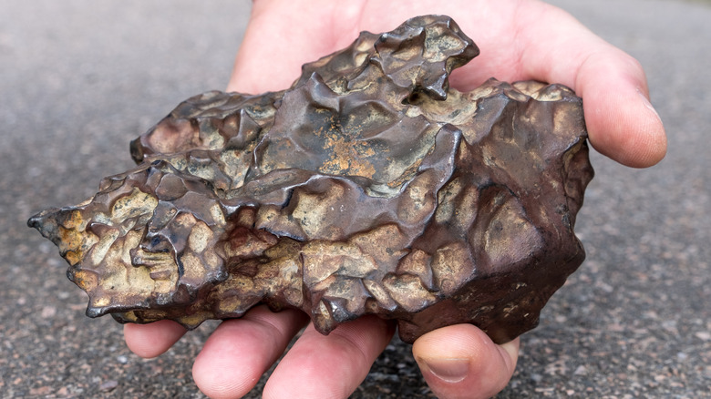 Iron meteorite in hand