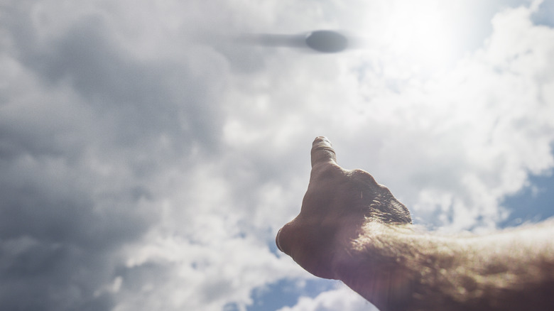 A witness points out a strange object in the sky