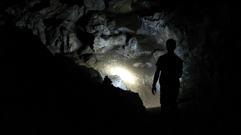 Man exploring abandoned mine