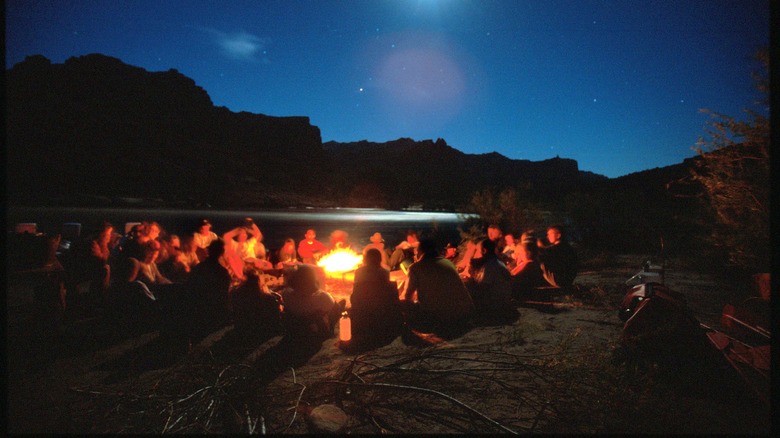 Campers sitting around a fire