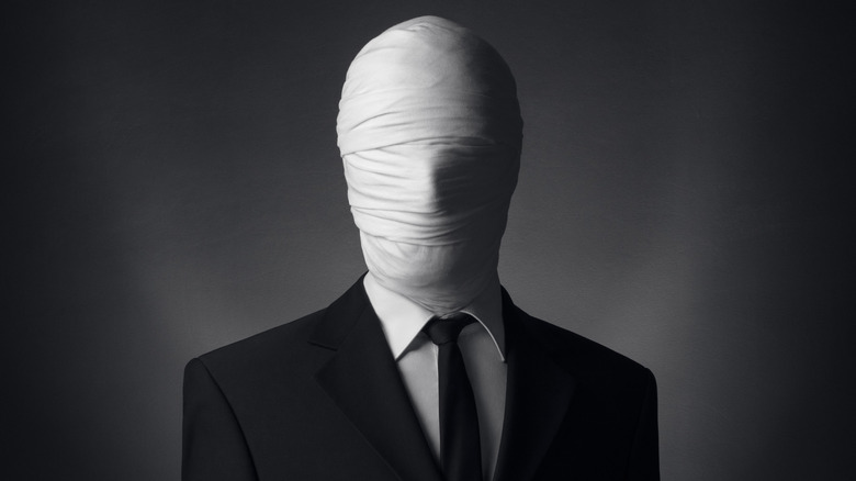Faceless man in suit