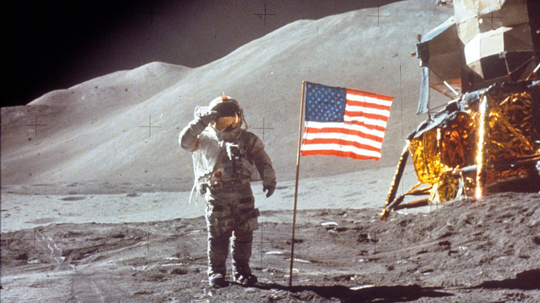 Astronaut David Scott saluting the American flag