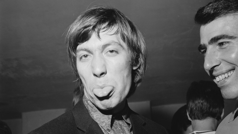 Charlie Watts with his tongue out