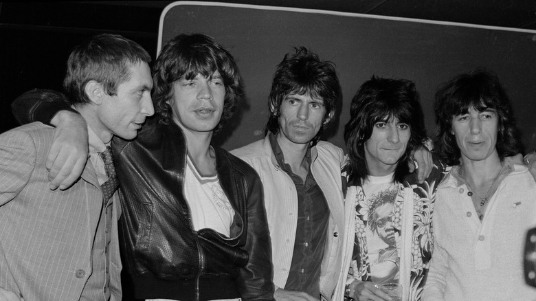 Charlie Watts looking sharp next to the other Stones