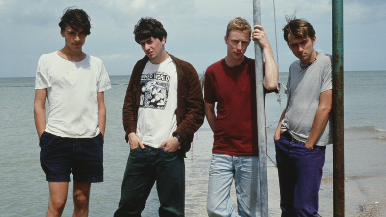 Members of Blur standing by the sea
